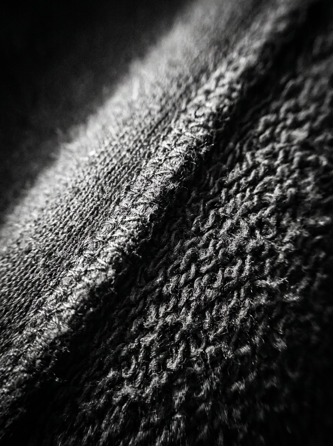 Macro detail of heavyweight brushed cotton fleece and a stitched seam